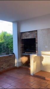a living room with a fireplace in a house at PARCELA VILLA PAU in Lebrija