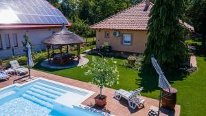 an aerial view of a backyard with a pool and a gazebo at Szemes Villa in Balatonszemes