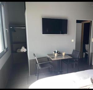 Postel nebo postele na pokoji v ubytování Logements des choraux