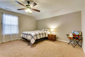 a bedroom with a bed and a ceiling fan at Bryant Vacation Rental about 16 Mi to Little Rock in Bryant