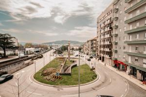 an empty street in a city with buildings at RACIA Lodges - Apartment in Viana do Castelo