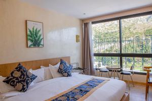 Postel nebo postele na pokoji v ubytování VANCII Hotel + 37 fotografií