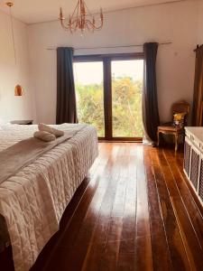 Ein Bett oder Betten in einem Zimmer der Unterkunft Casa em Alto Paraíso com vista para as montanhas no Eldorado ao lado do centro