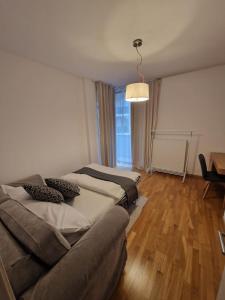 a living room with a couch and a bed at Anvers Apartament in Bucharest