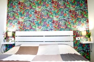 En eller flere senge i et værelse på Viareggio Deluxe