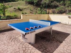 a ping pong table sitting on a patio at La casa de Mati in Córdoba