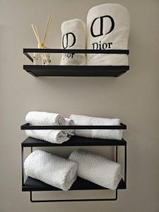a towel rack with towels on a wall at Chic Queen Anne Retreat in Seattle