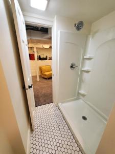 een kleine badkamer met een douche en een toilet bij 127 Hwy 71 Main House in Arnolds Park
