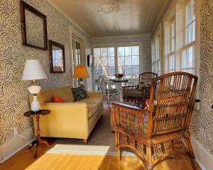 a living room with a couch and a table at 127 Hwy 71 Main House in Arnolds Park