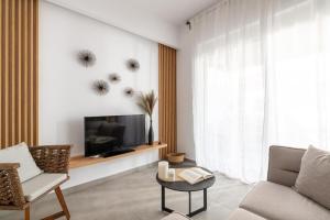 TV a/nebo společenská místnost v ubytování Venthos Apartments