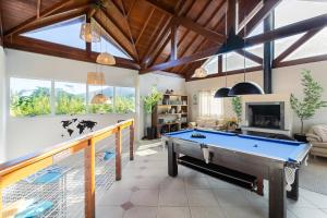 a living room with a pool table in it at Penareia Floripa Beach Hotel in Florianópolis +93 photos