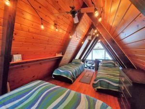 Ένα ή περισσότερα κρεβάτια σε δωμάτιο στο Sandy Beach Retreat on Big Spirit Lake