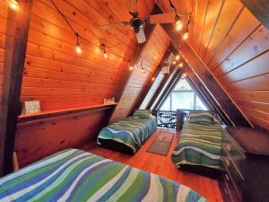 Postel nebo postele na pokoji v ubytování Sandy Beach Retreat on Big Spirit Lake