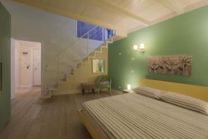 a bedroom with a bed and a staircase at Margarida Apartment in Florence