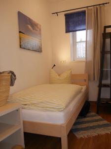 Postel nebo postele na pokoji v ubytování Lindenhof Wohnung 2, Erdgeschoß