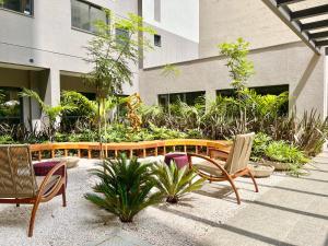 O grădină în afara Apartamento Espaçoso e Aconchegante na Bela Vista