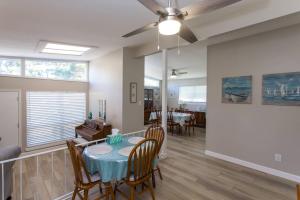 a dining room and living room with a table and chairs at Cathy and Jim's Florida Beach House in Fort Walton Beach +24 photos