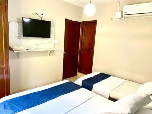 Cama o camas de una habitación en Hotel Bahia Suite