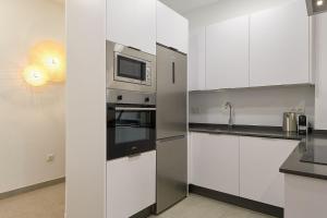A kitchen or kitchenette at Soho Apartments in Malaga by Solaga Holiday Homes
