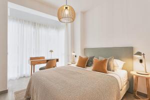 A bed or beds in a room at Soho Apartments in Malaga by Solaga Holiday Homes