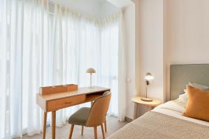 A bed or beds in a room at Soho Apartments in Malaga by Solaga Holiday Homes
