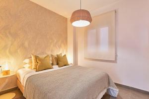 A bed or beds in a room at Soho Apartments in Malaga by Solaga Holiday Homes