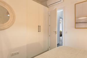 A bed or beds in a room at Soho Apartments in Malaga by Solaga Holiday Homes
