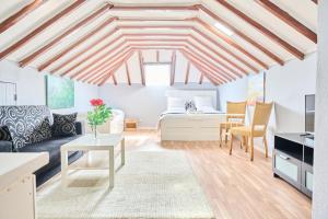 a living room with a bed and a table at The Delight Hostel in Lisbon