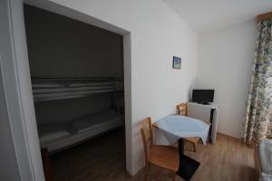 TV in/ali zabaviščno središče v nastanitvi Hotel Kleinmünchen