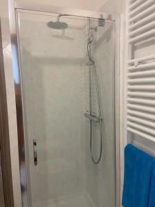 a shower with a glass door in a bathroom at Casa Vittorina in Pula