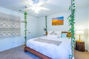 a bedroom with a swinging bed with a ceiling fan at Fairy Tale 13-acre Sunset Villa at Windy Gap Valley near Yosemite in Ahwahnee +82 photos