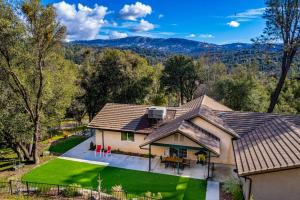 an aerial view of a house with a roof at Mystic Mountain Villa, 14 miles from Yosemite in Oakhurst
