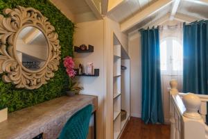 a room with a mirror and green wall at Star Jasmine House Acharavi in Litherés
