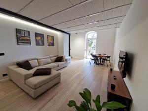 a living room with a couch and a table at REGINA Loft in Ospedaletti