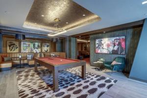 a billiard room with a pool table in it at Gorgeous 1 Bedroom At Clarendon With Gym and Rooftop in Arlington