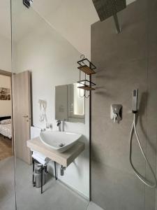 a bathroom with a sink and a shower at Villa Liliana in Cervia