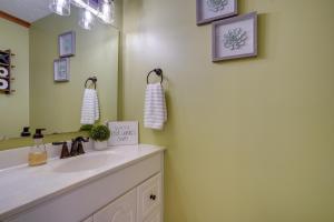 a bathroom with a sink and a mirror at Sauna, Spa and Stargazing Coudersport Home! in Coudersport +37 photos