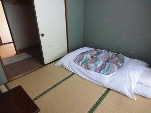 Postel nebo postele na pokoji v ubytování Hotel Sankyu + 17 fotografií
