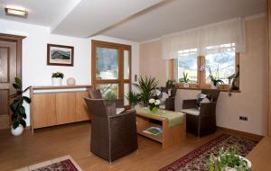 a living room with chairs and a table at Haus Alpina in Au im Bregenzerwald