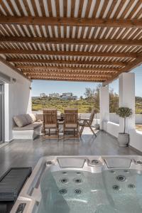 a hot tub in the middle of a living room at Casa Aelia ,Stelida Naxos in Stelida
