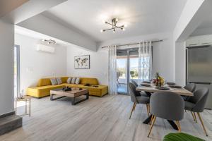 a living room with a couch and a table at Casa Aelia ,Stelida Naxos in Stelida