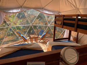 Postel nebo postele na pokoji v ubytování Ku kuk Glamping