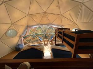 Postel nebo postele na pokoji v ubytování Ku kuk Glamping