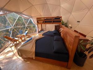 a room with two beds in a tent at Ku kuk Glamping in Chemuyil