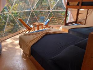 Postel nebo postele na pokoji v ubytování Ku kuk Glamping