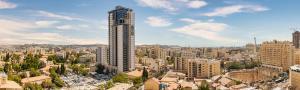 a view of a city with a tall building at Apartments At The Window Of Jerusalem, Jaffa 97 in Jerusalem