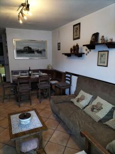 a living room with a couch and a table at Cervinia Apartments in Breuil-Cervinia