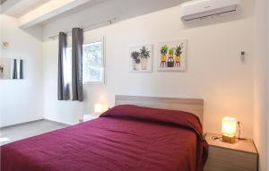 Voodi või voodid majutusasutuse Nice Home In Santa Croce Camerina toas