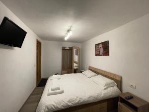 Postel nebo postele na pokoji v ubytování Casa Lupilor Transfăgărășan + 37 fotografií