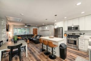 a kitchen and living room with a table and chairs at Captivating 3 Bedroom Home W Hot Tub in Citrus Heights